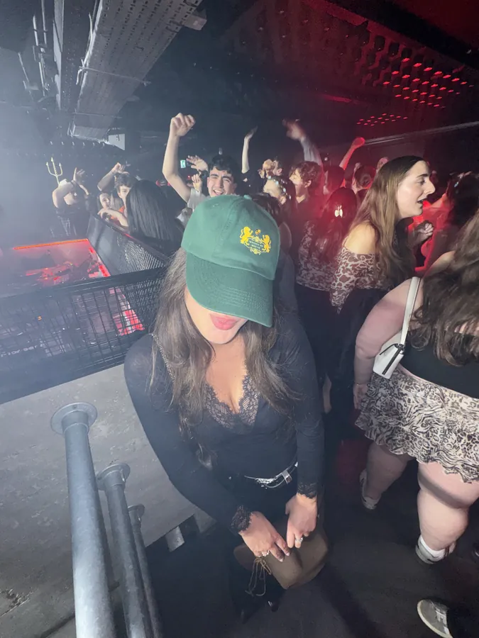 Guest in a green Maison of House cap
